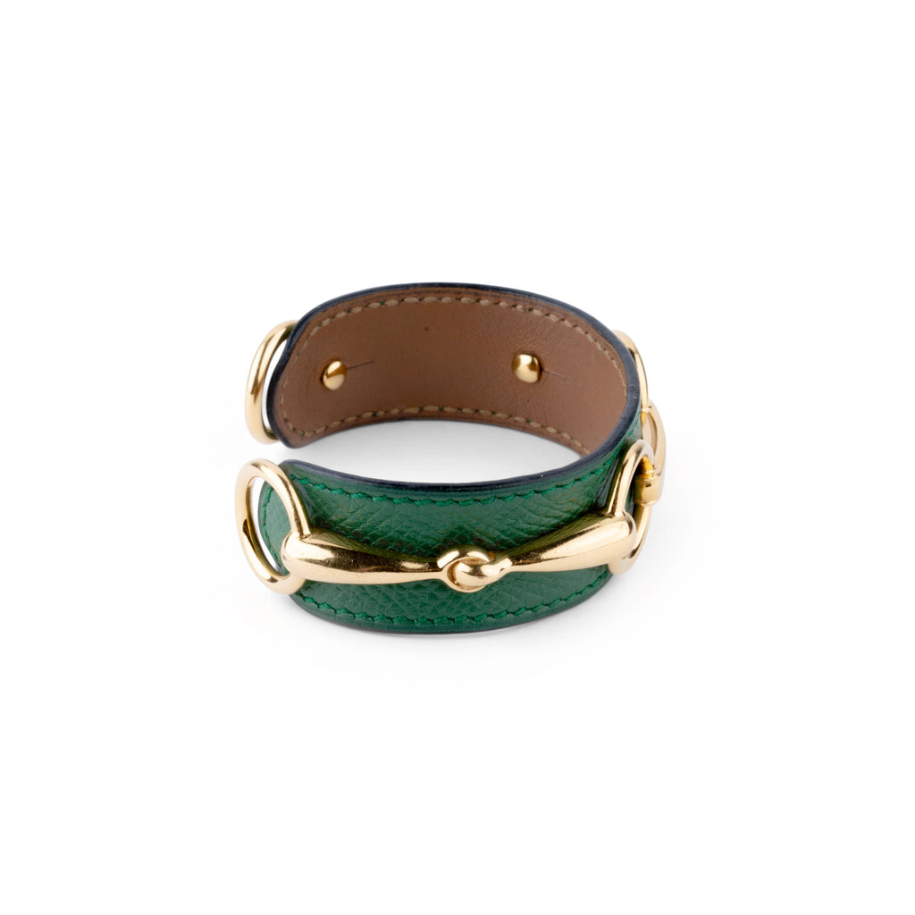 Bracelet de la maison Hermès en cuir et métal doré