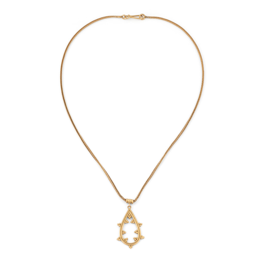 Chaîne en or jaune et pendentif assorti ciselé du créateur grec Zolotas