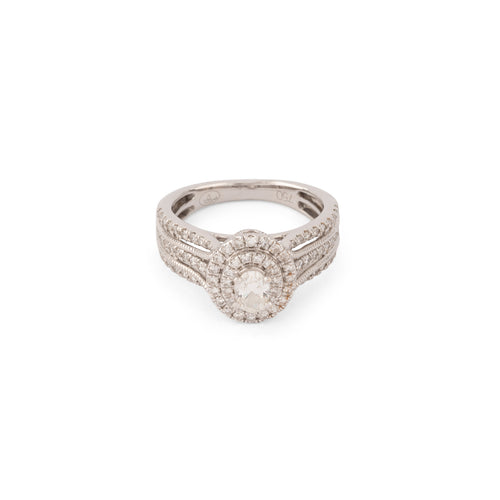 White gold ring set with an oval diamond and pavé-set diamonds