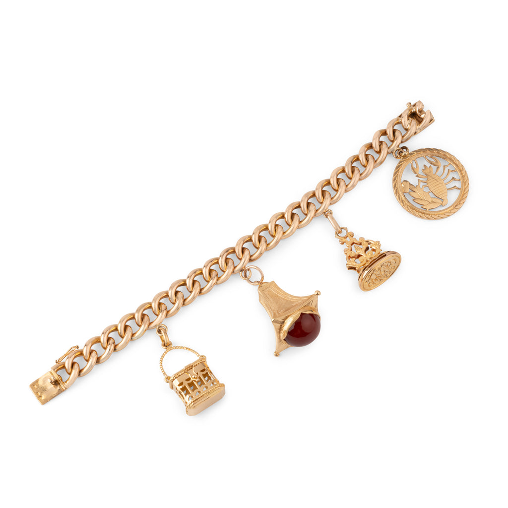 Bracelet or rose 18k,maillon gourmette orné de 4 breloques
