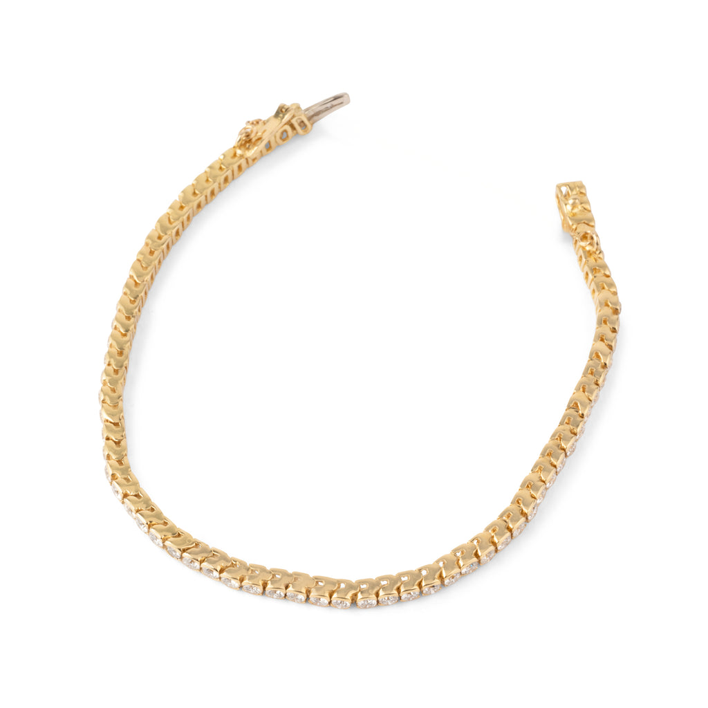 Bracelet riviere en diamant, sur or jaune en serti semi-clos