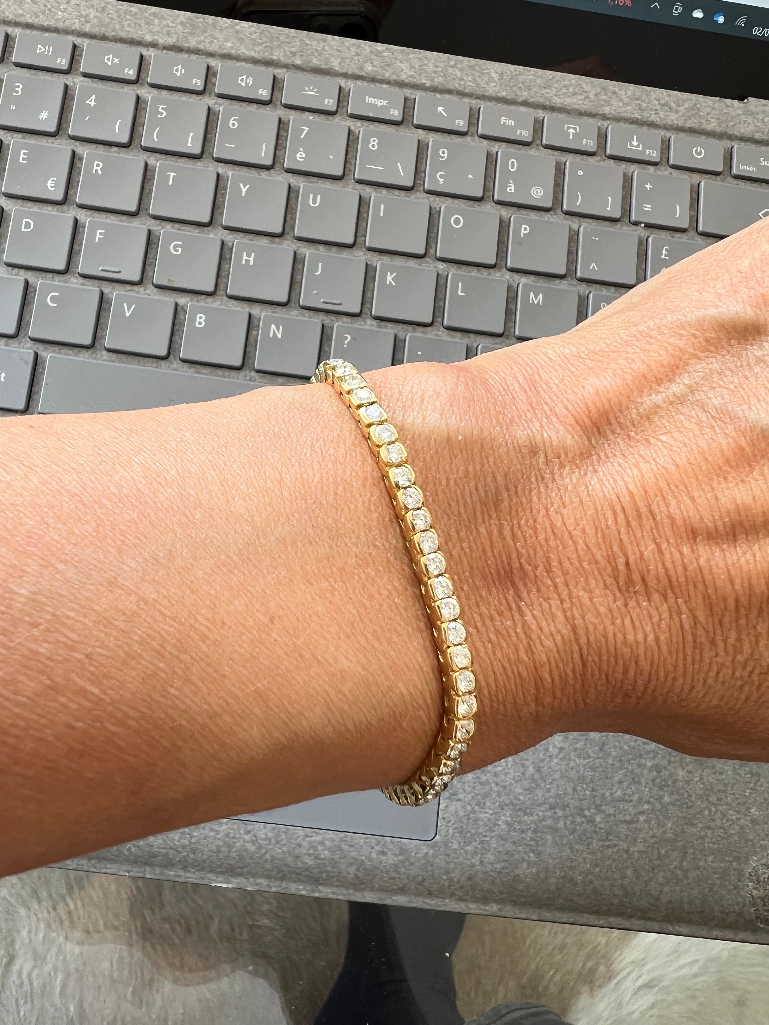 Bracelet riviere en diamant, sur or jaune en serti semi-clos