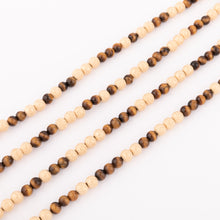 Charger l'image dans la galerie, Sautoir en perles d'or ciselés et perle yeux de tigre
