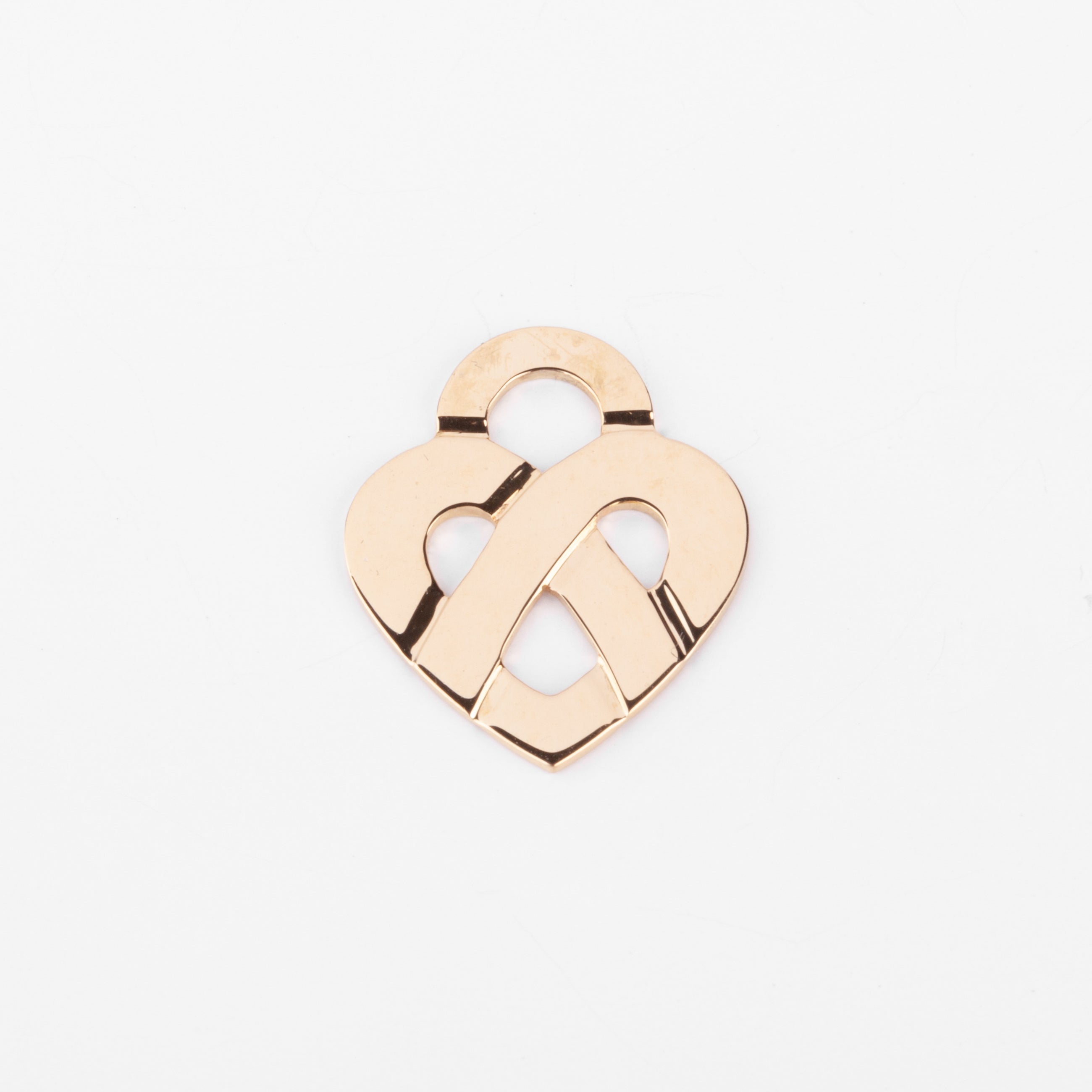 Pendentif en or jaune formant un cœur de la maison Poiray