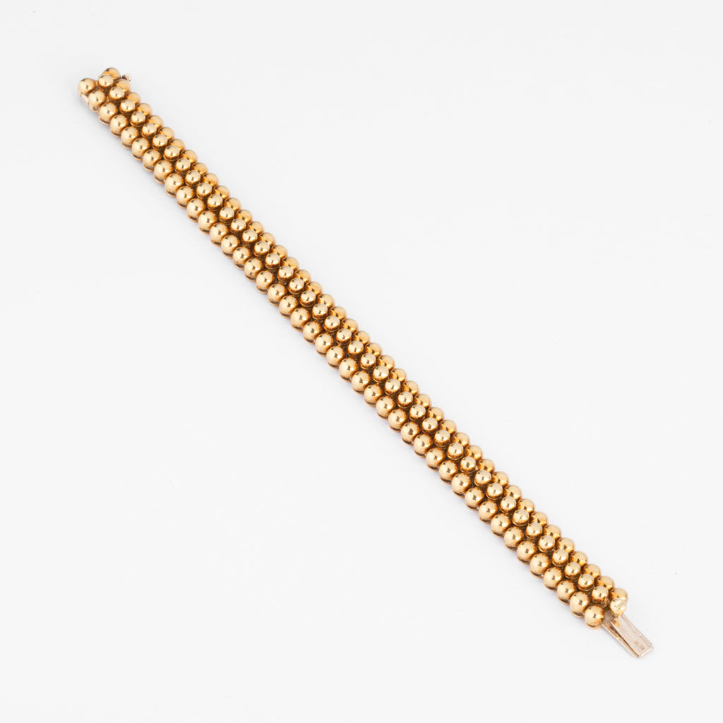 Bracelet or jaune 18k signé et numéroté de la maison Boucheron collection Grains de Raisin