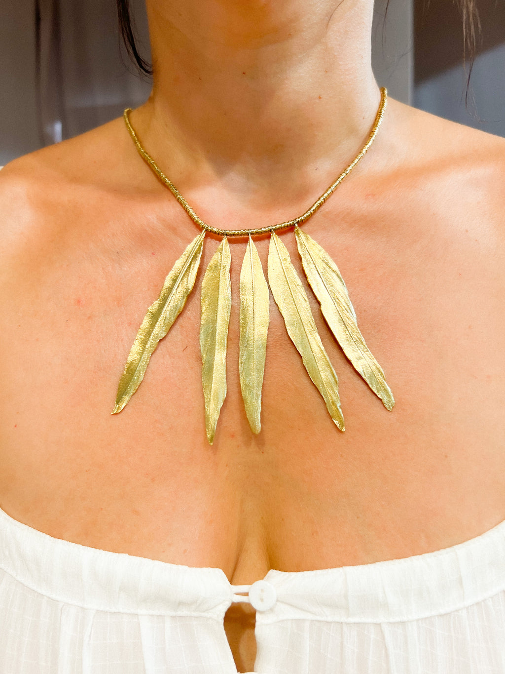 Collier en or H.Stern formant des plumes en or
