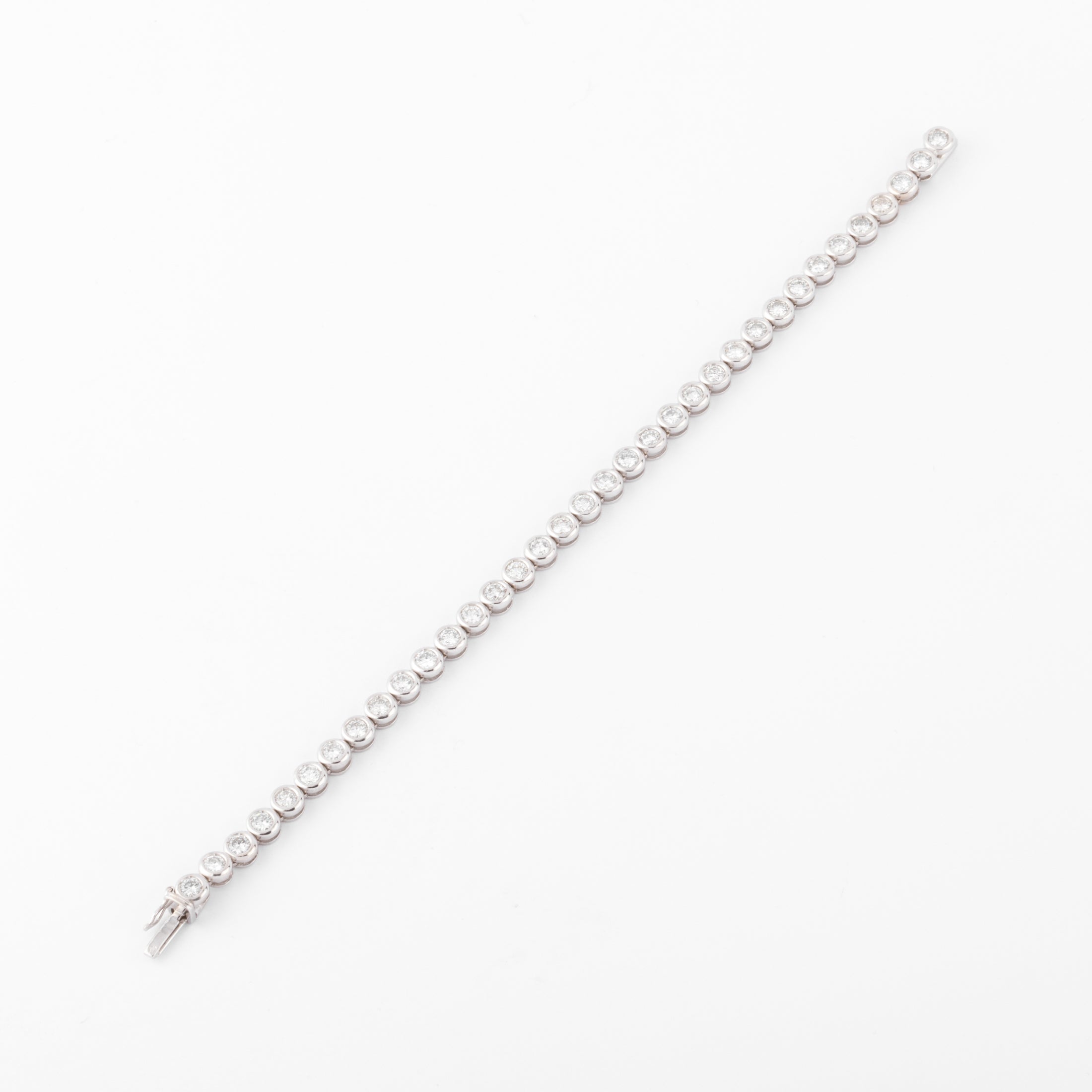 Bracelet en or gris et diamants tennis serti tennis