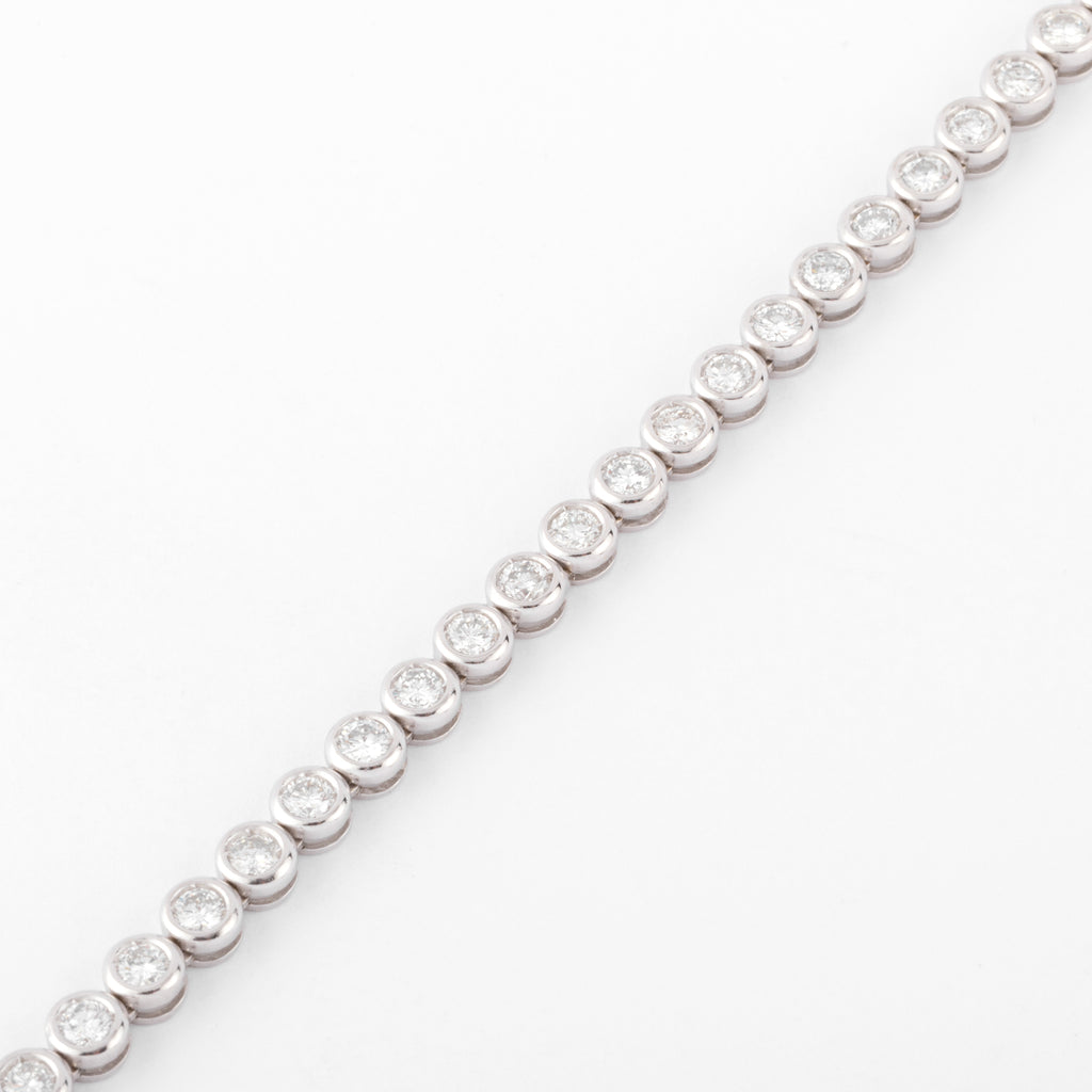 Bracelet en or gris et diamants tennis serti tennis