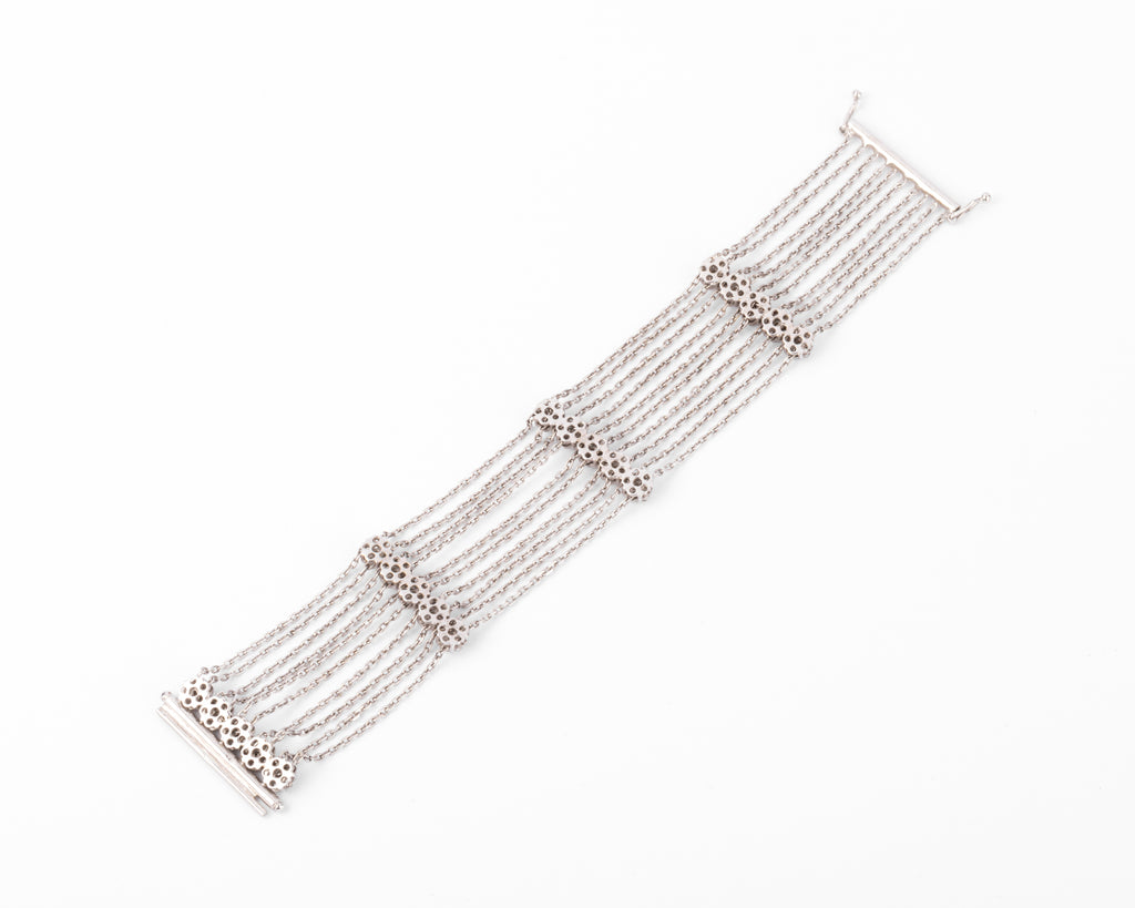 Bracelet or gris et diamant sur chaine força limée alternée de 4 motifs avec des fleurs
